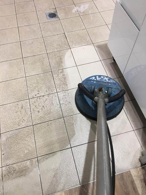 Tile and grout cleaning with a rotary surface cleaner