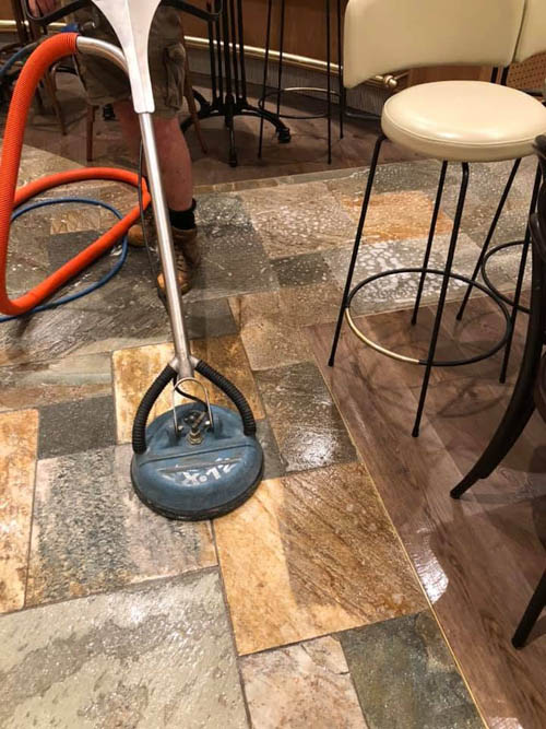 Tile and grout cleaning with a rotary surface cleaner