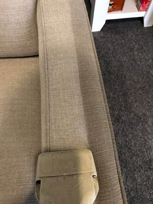 Before and after upholstery cleaning on a fabric lounge