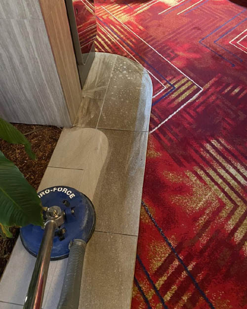 Tile and grout cleaning with a rotary surface cleaner