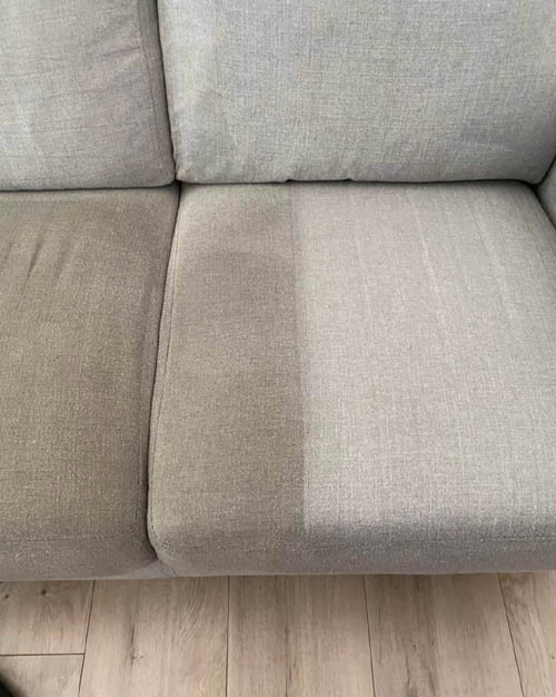 Upholstery tool lifting dirt from a fabric seat